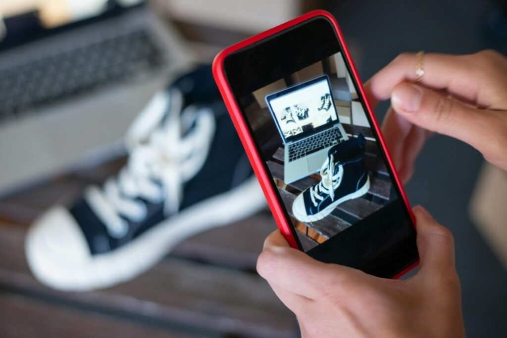 Capturing sneakers with a mobile phone for an online store showcase. E-commerce at its best.